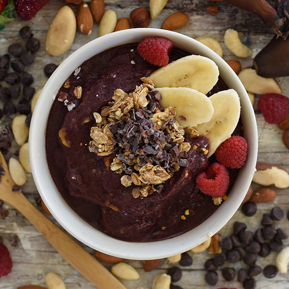 Acai bowl with berries and cacao nibs.